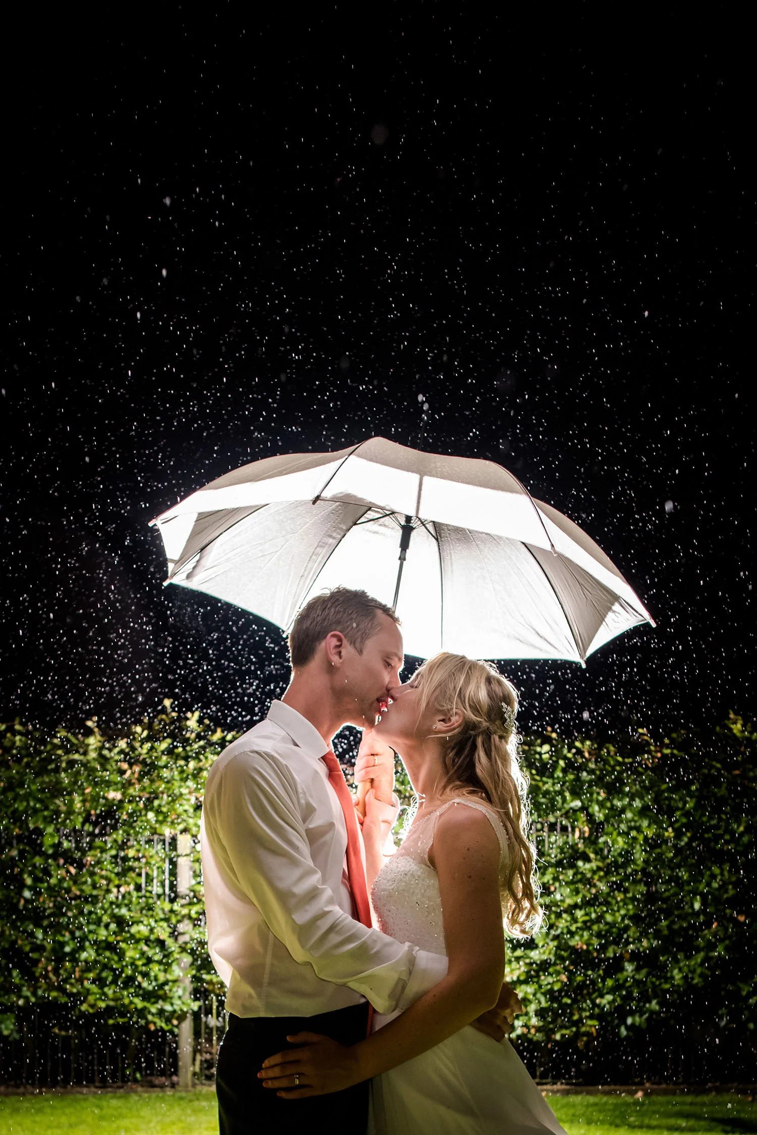 wedding-couple-kissing-rain-jma-photography.jpg