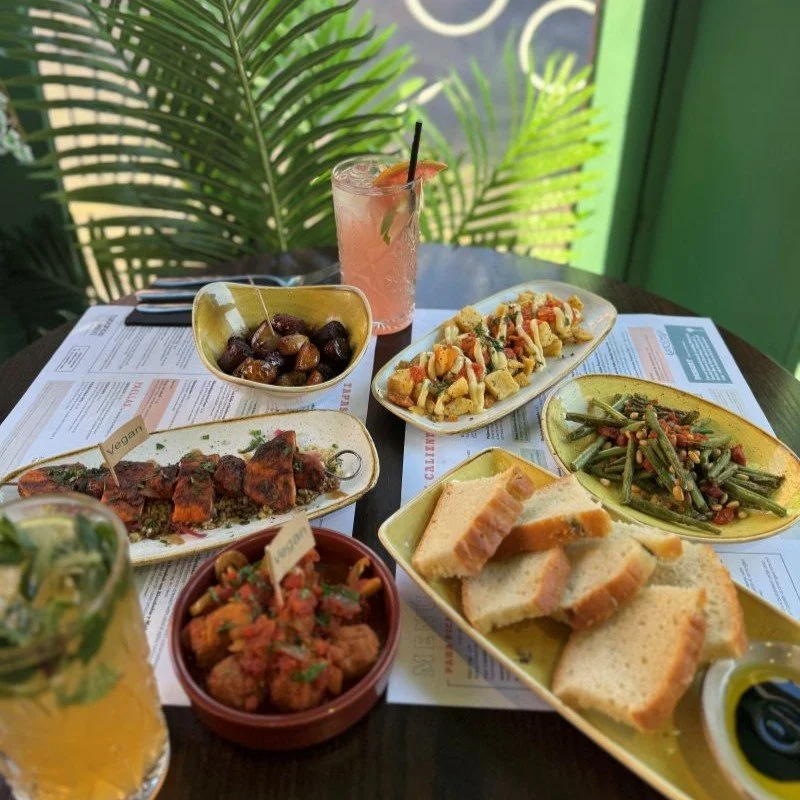 tapas in window circle table with mocktails - web ready.jpg