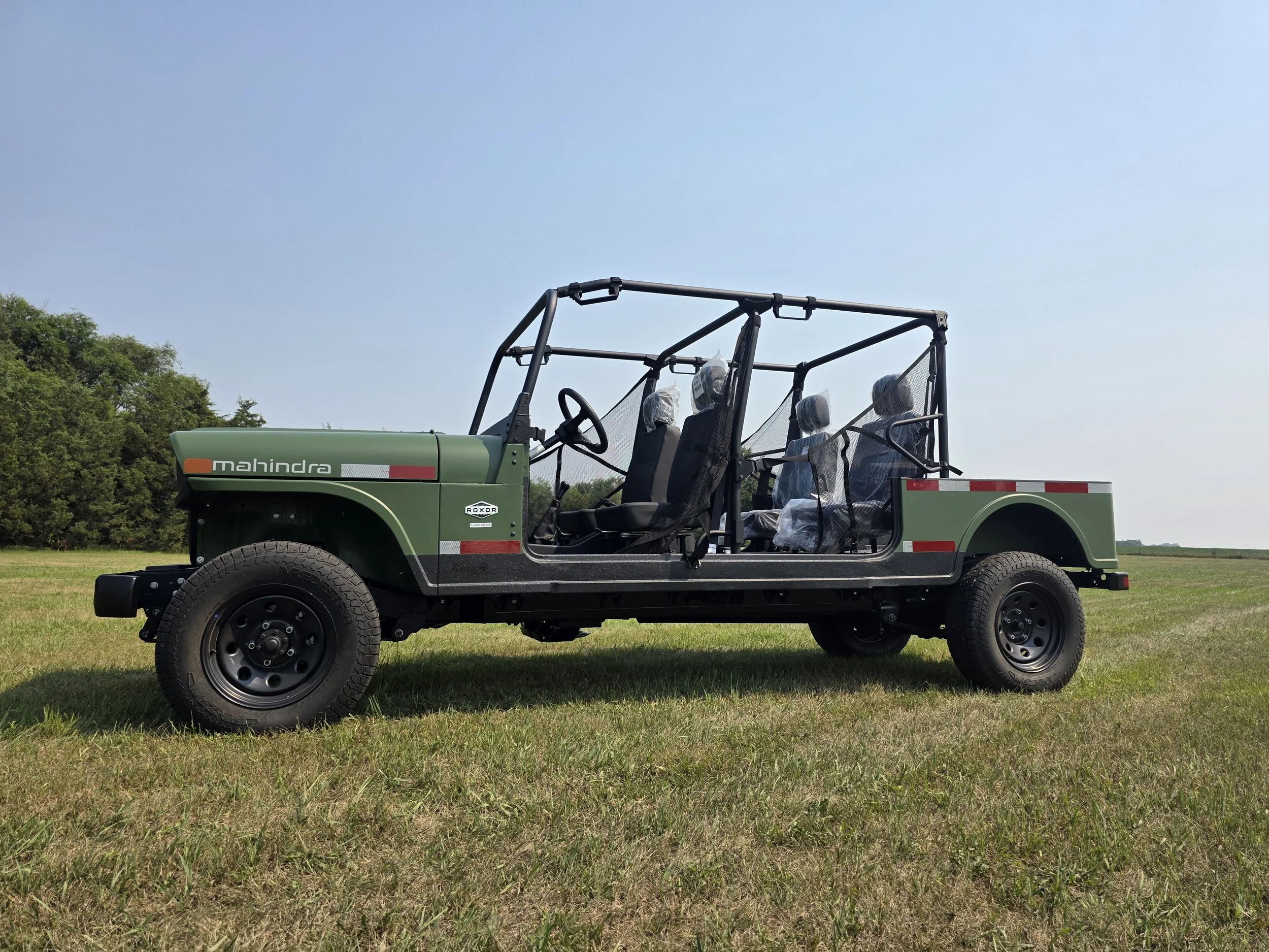 Green four-door Mahindra ROXOR converted by King Series