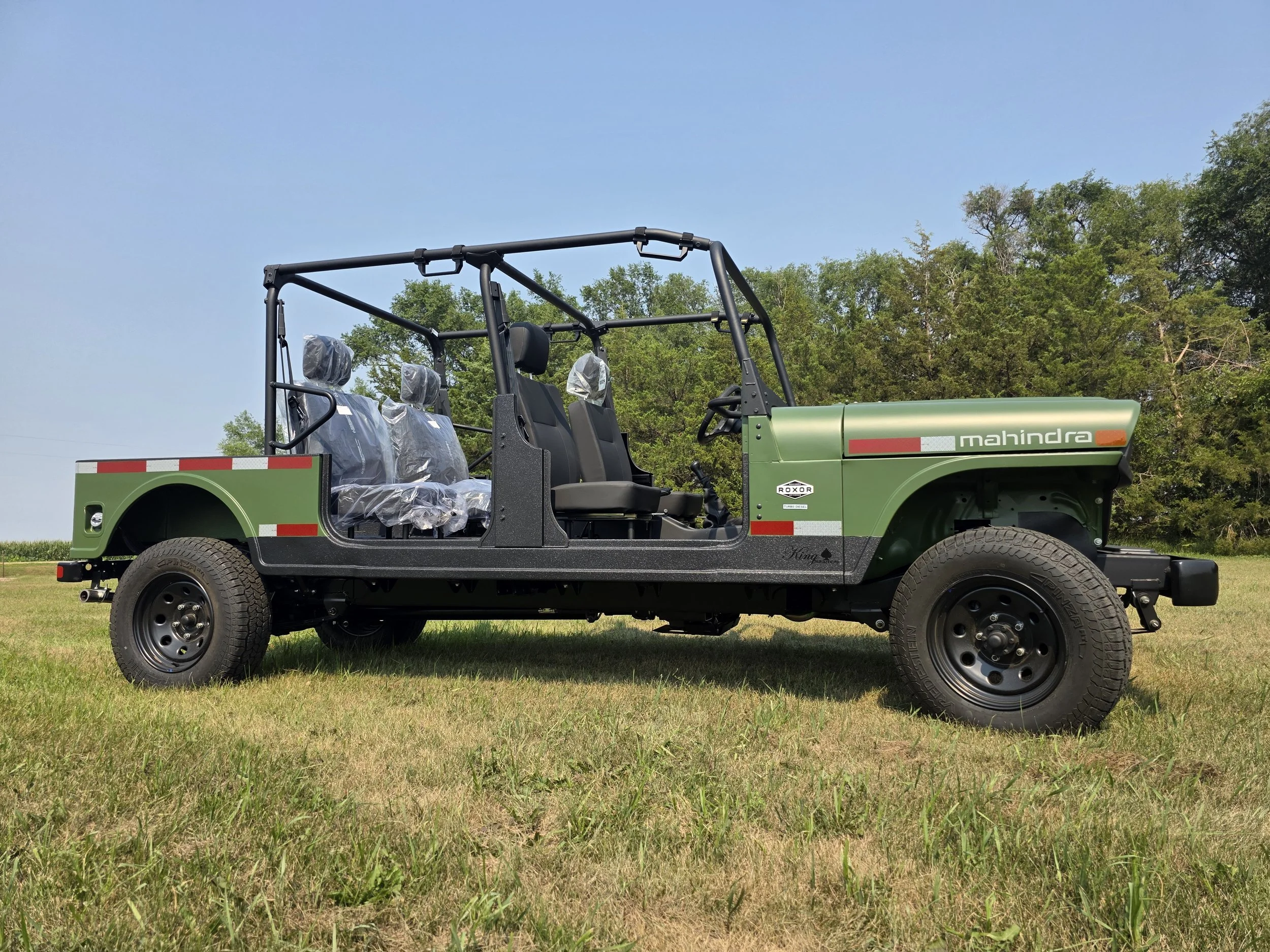 Green four-door ROXOR with ISO 3471-certified ROPS