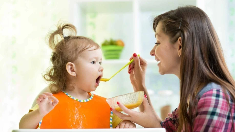 mother-feeding-toddler-918x516.jpg