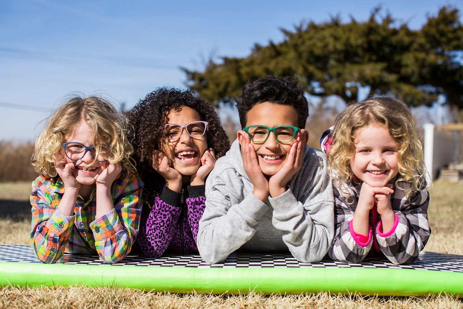 4 kids wearing Fitz Frames glasses and having fun