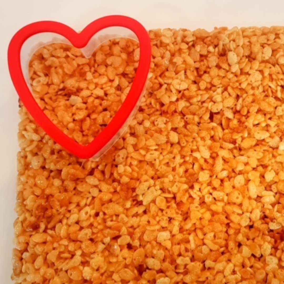  Making this Valentine’s Day dessert is really quite simple.  When making Rice Krispie treats, they are really super simple with a few steps and all we have to do is add a few more which are very simple.  
