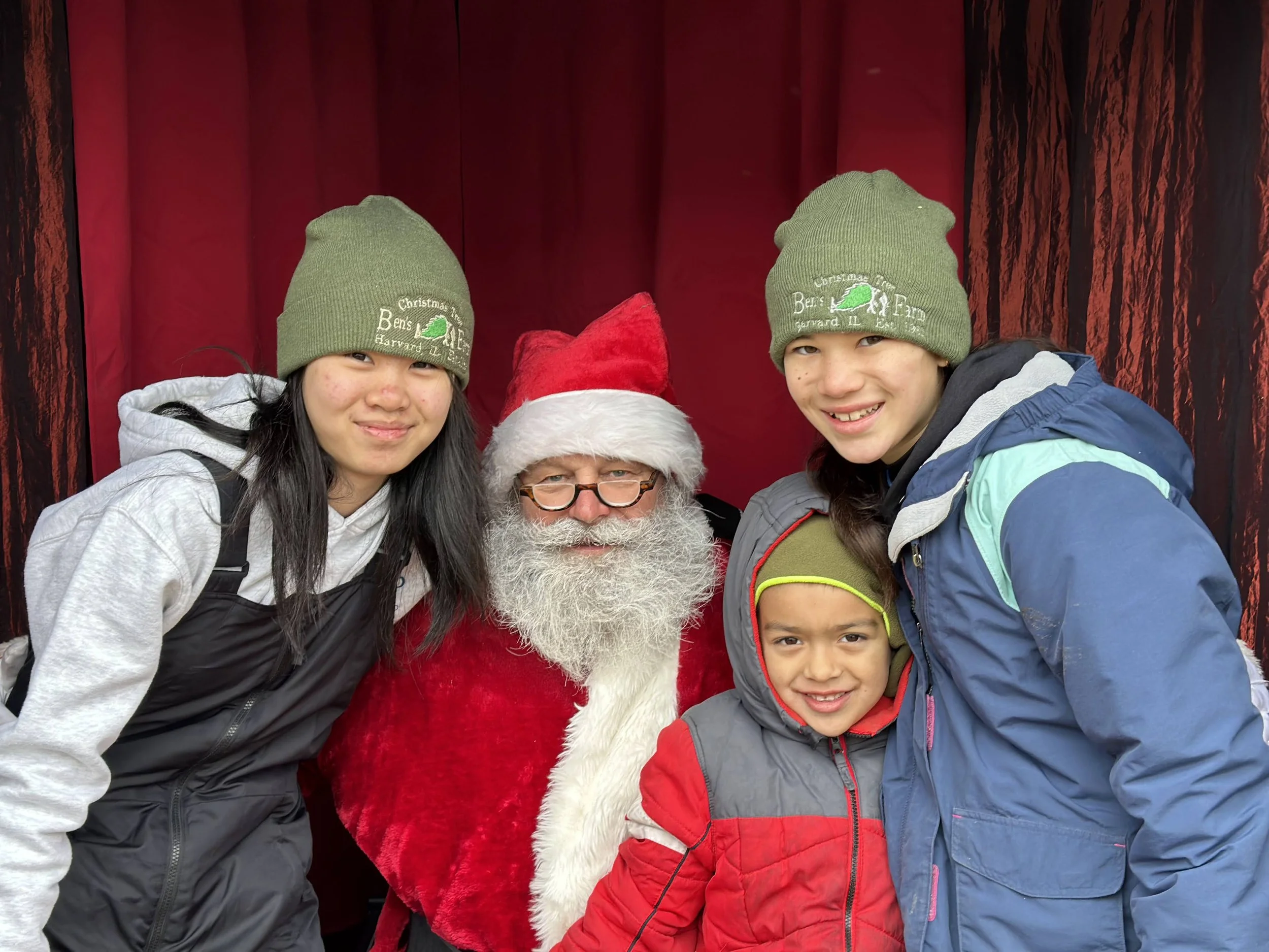 Janny (left)  Peter (center) and Julia (right) Czarnowski visit Santa at Bens Tree Farm in Harvard IL.jpg