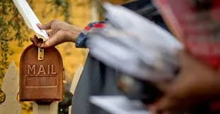 mail carrier delivering mail.jpg