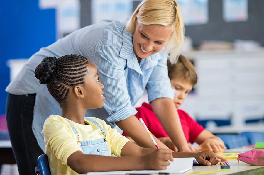 teacher helping student