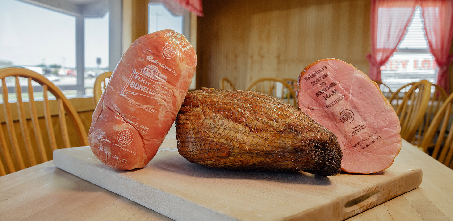 boneless hams on a cutting board at Robertson’s Hams