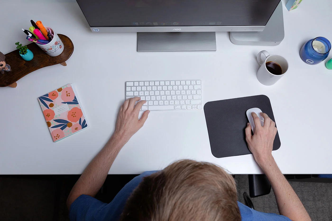 business professional typing at a computer