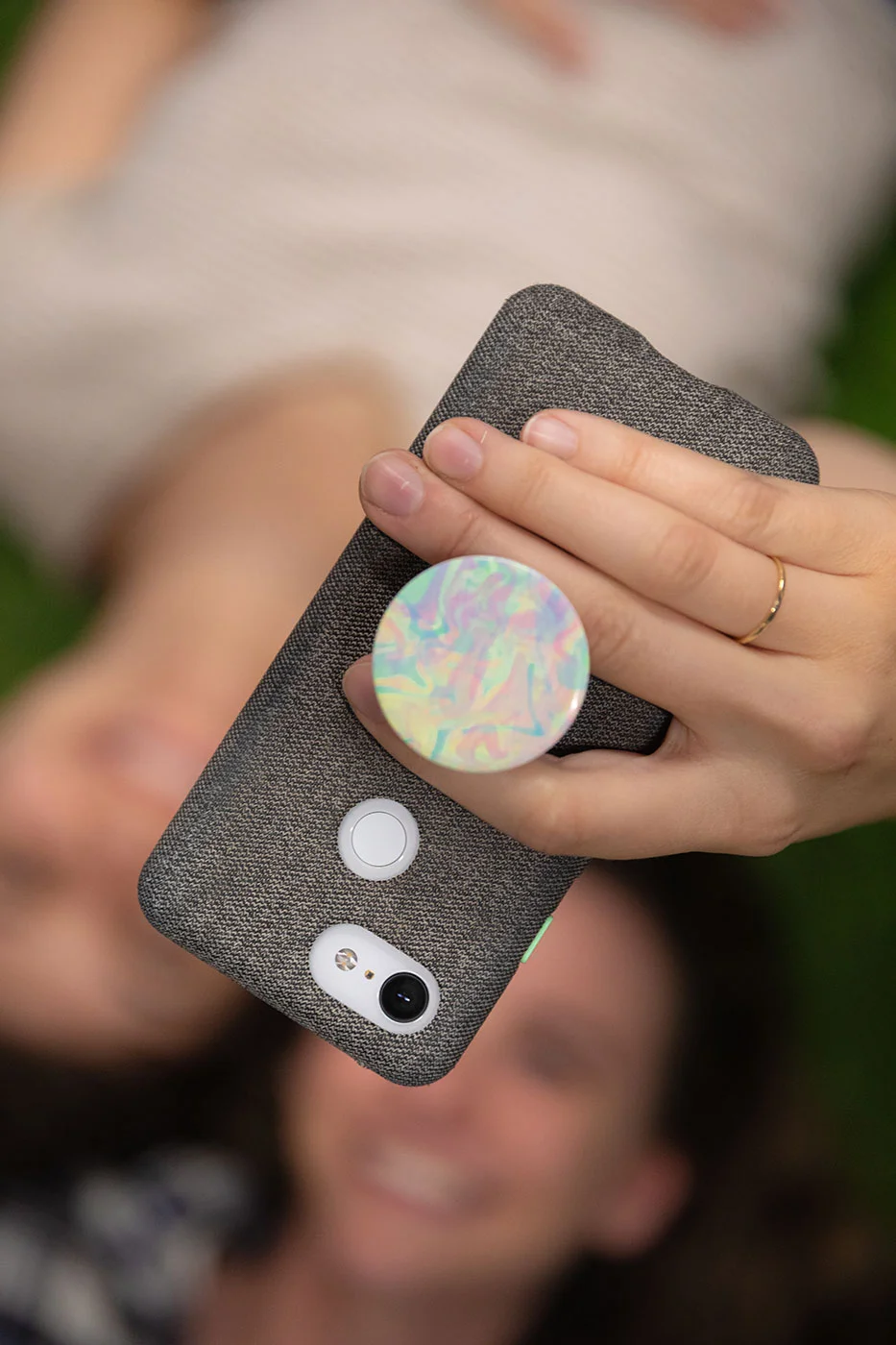 girls taking a selfie with a cell phone