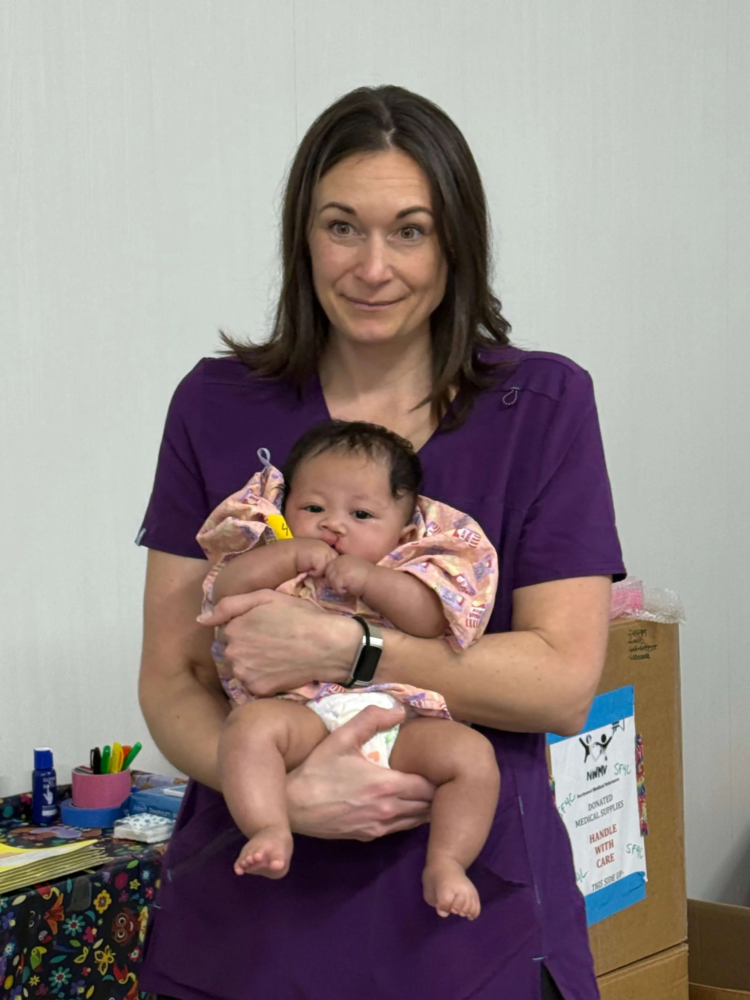 Childlife specialist, Bobbijo Pansier calms a patient