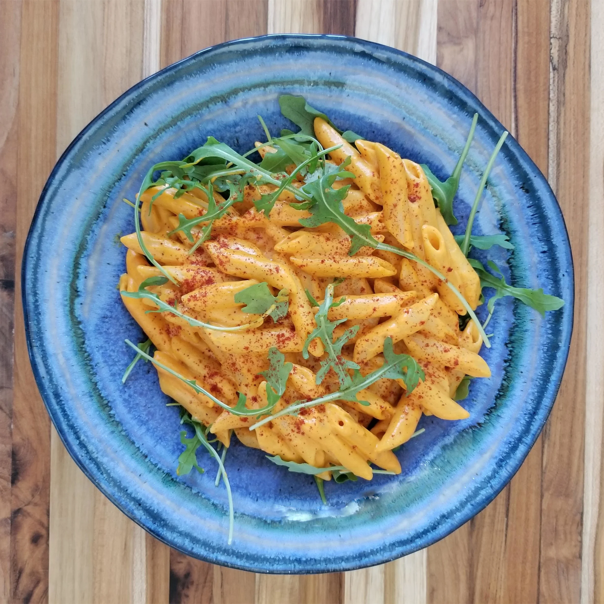 Red Pepper Alfredo Penne Pasta served with arugula (vegan)