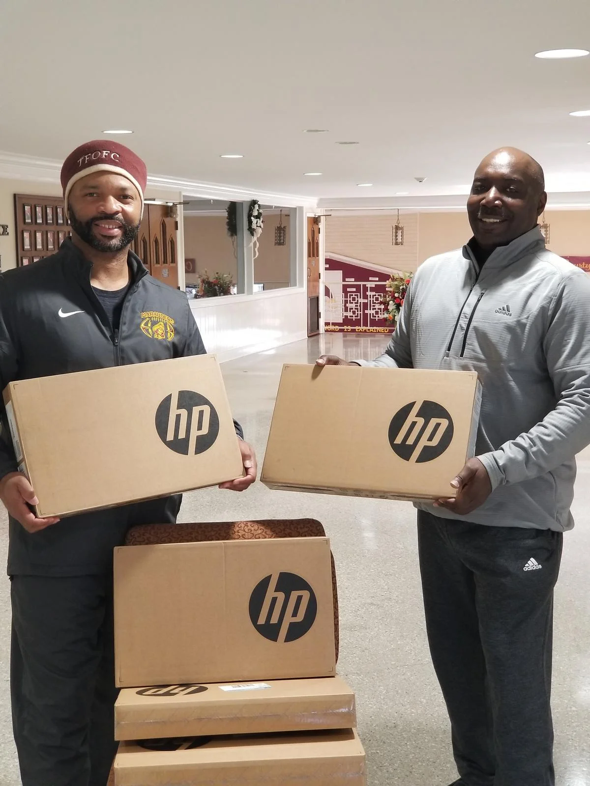 KJIF Vice President, Kerry Johnson, delivering computers to help with the Fellowship of Faith Workforce Development Program.