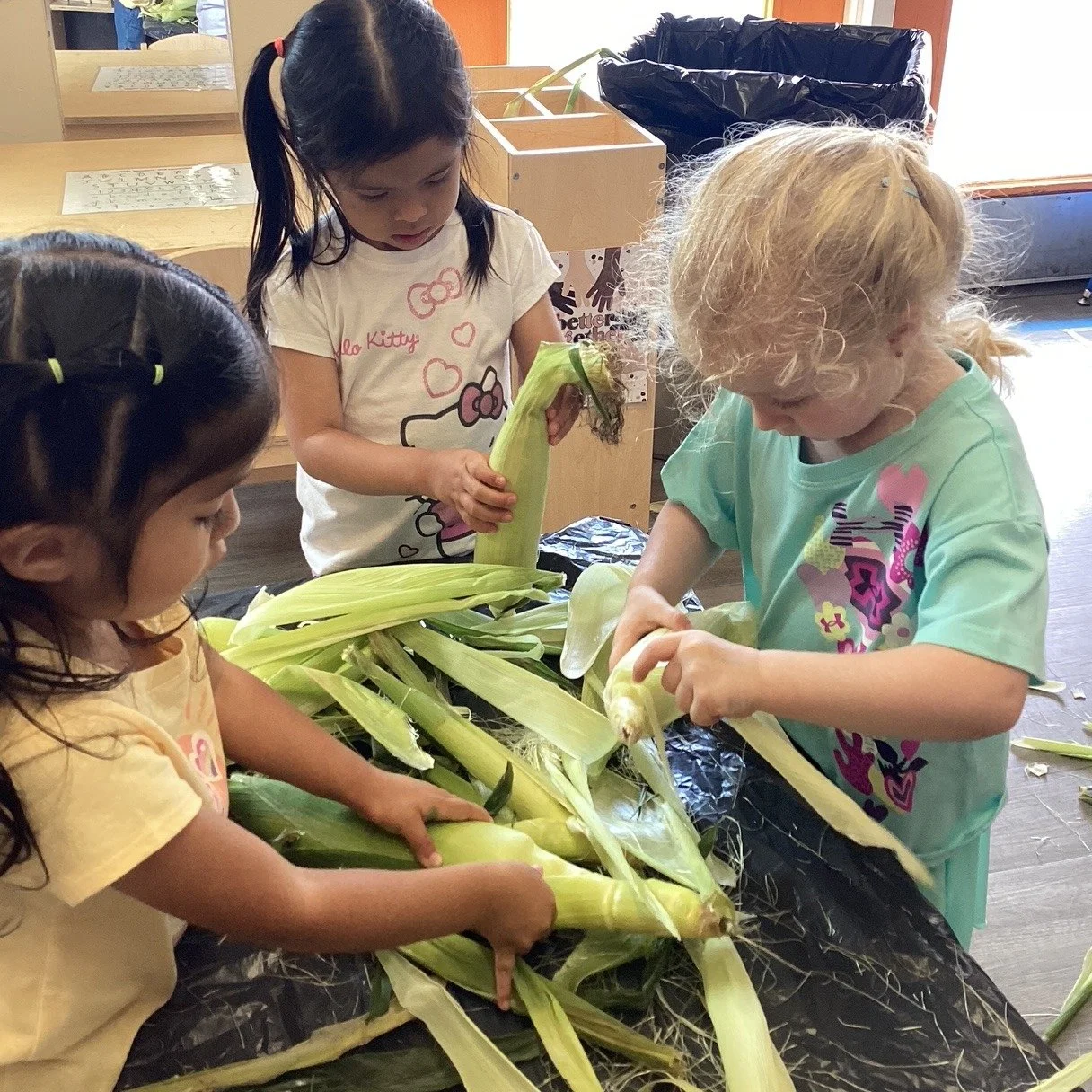 Today is National Corn on the Cob Day! The Orange Room celebrated by shucking corn and listening to country music 🌽 🧡