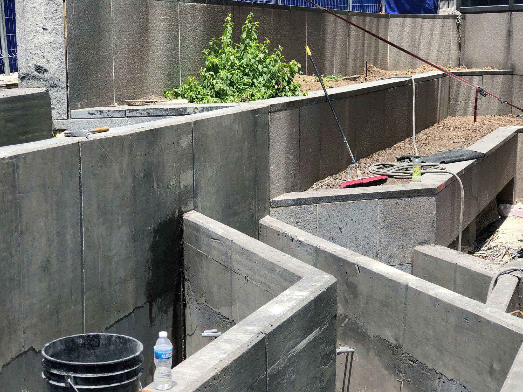  Concrete was poured and sealed for the planters and bench seating at the 4th &amp; Commerce entrance 