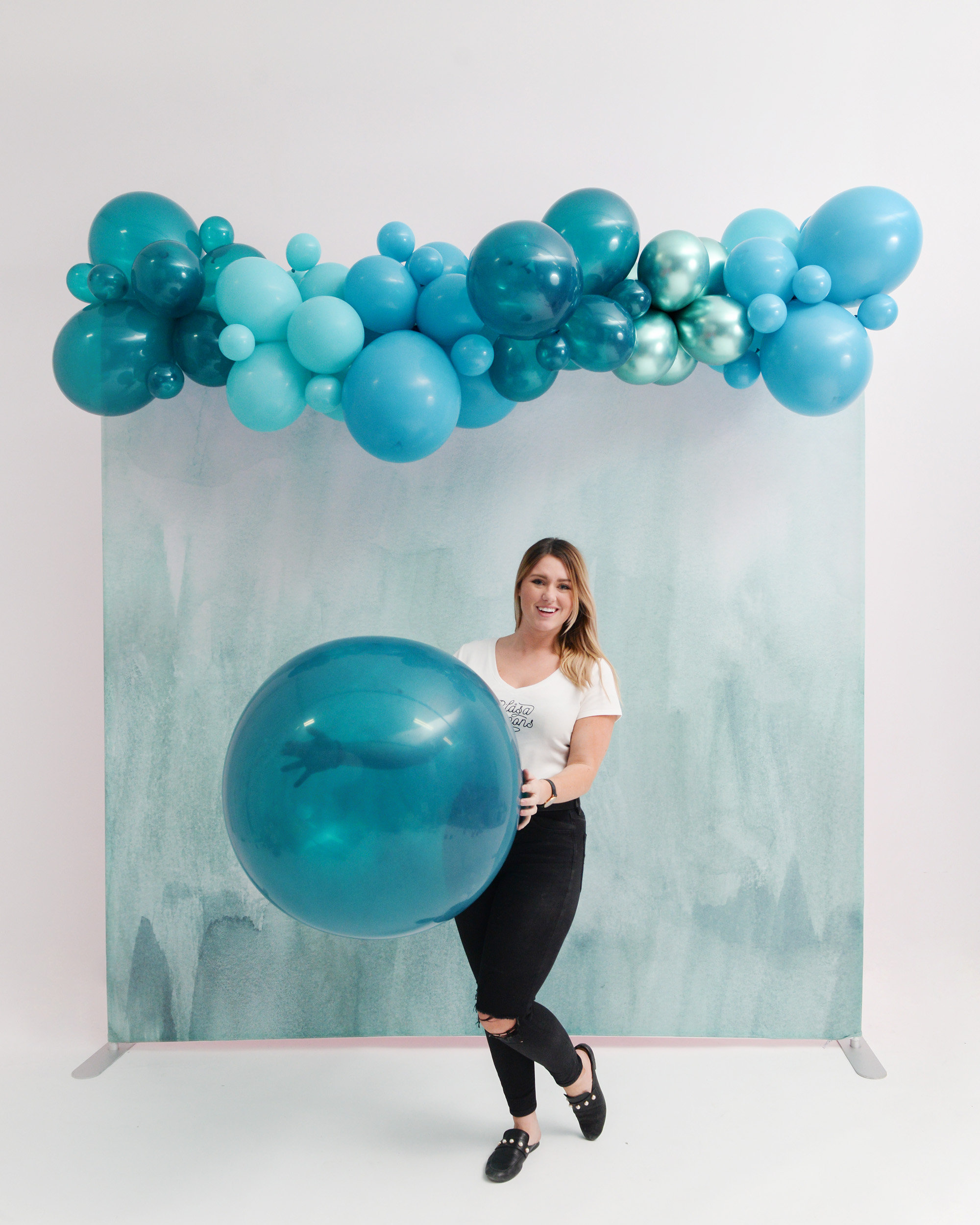 Girl with Teal Jumbo Balloon