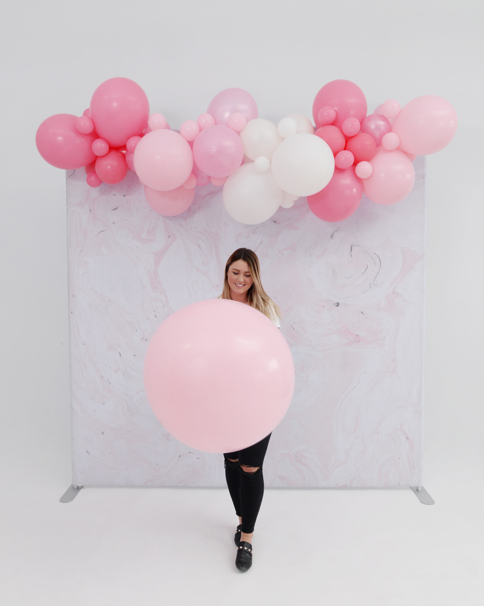 Girl With Light Pink Jumbo Balloon