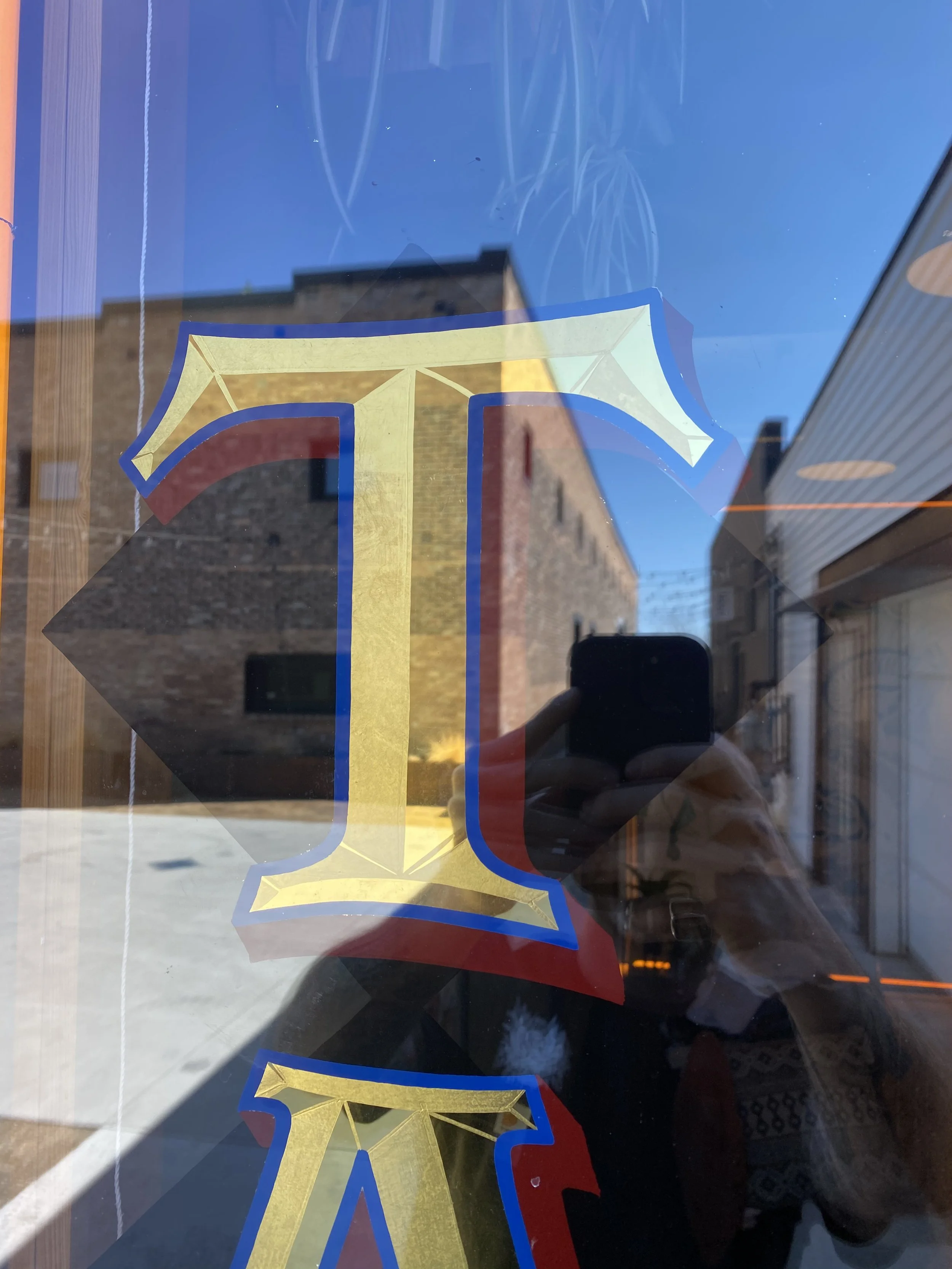 Detail of a Convex Gold Letter