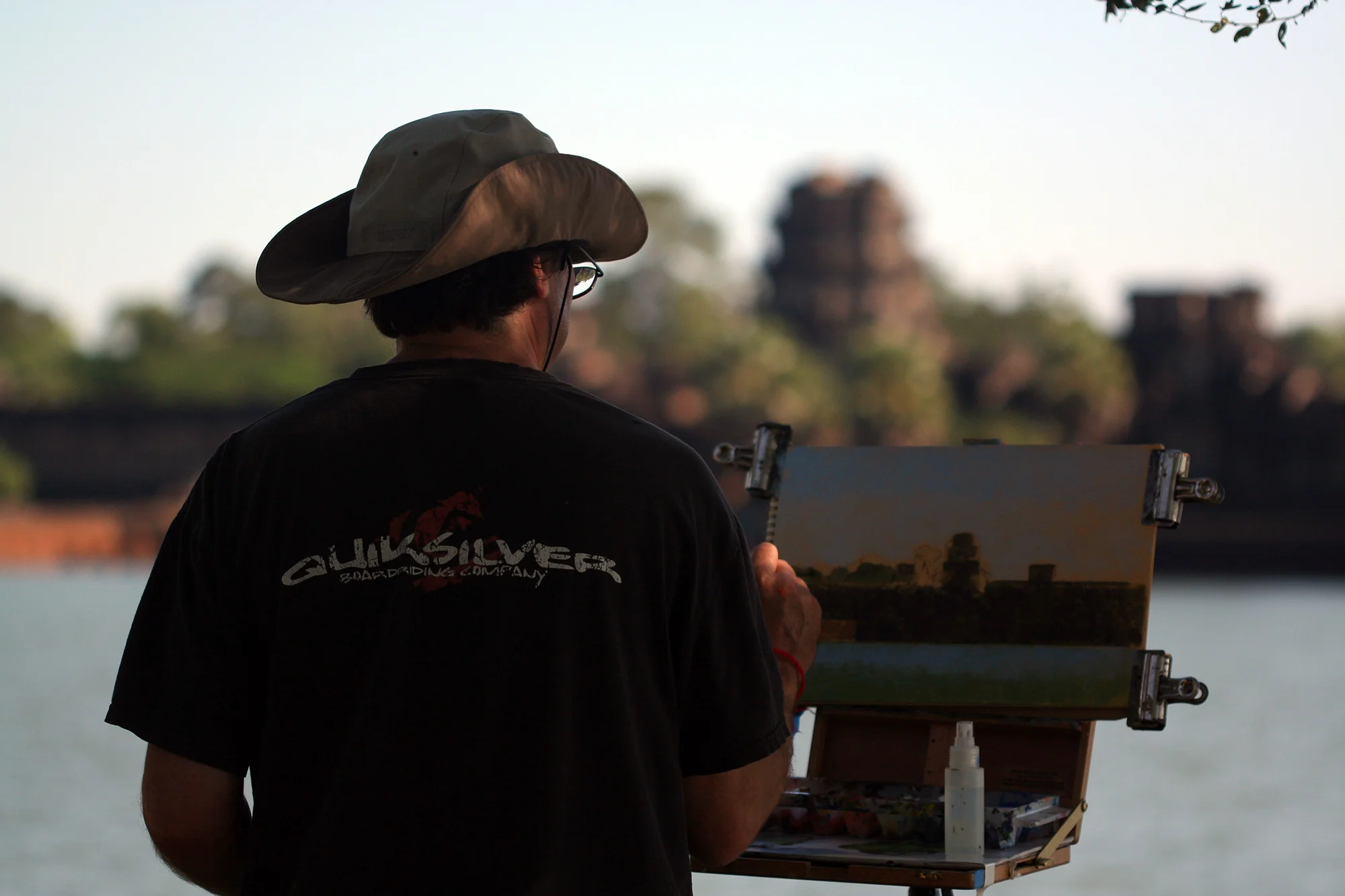 James Warren Perry painting at the Temple of Angkor Wat, Cambodia.
