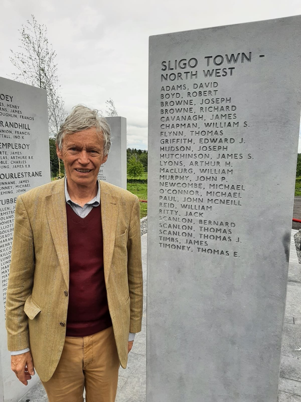  Treasurer of LSF, Richard Lyons pictured beside two sentinels bearing the names of relatives who died in the Great War. Hugh Nesham, grandfather of Richard is listed under the town-land Collooney. Arthur Lyons, great uncle of Richard Lyons is listed