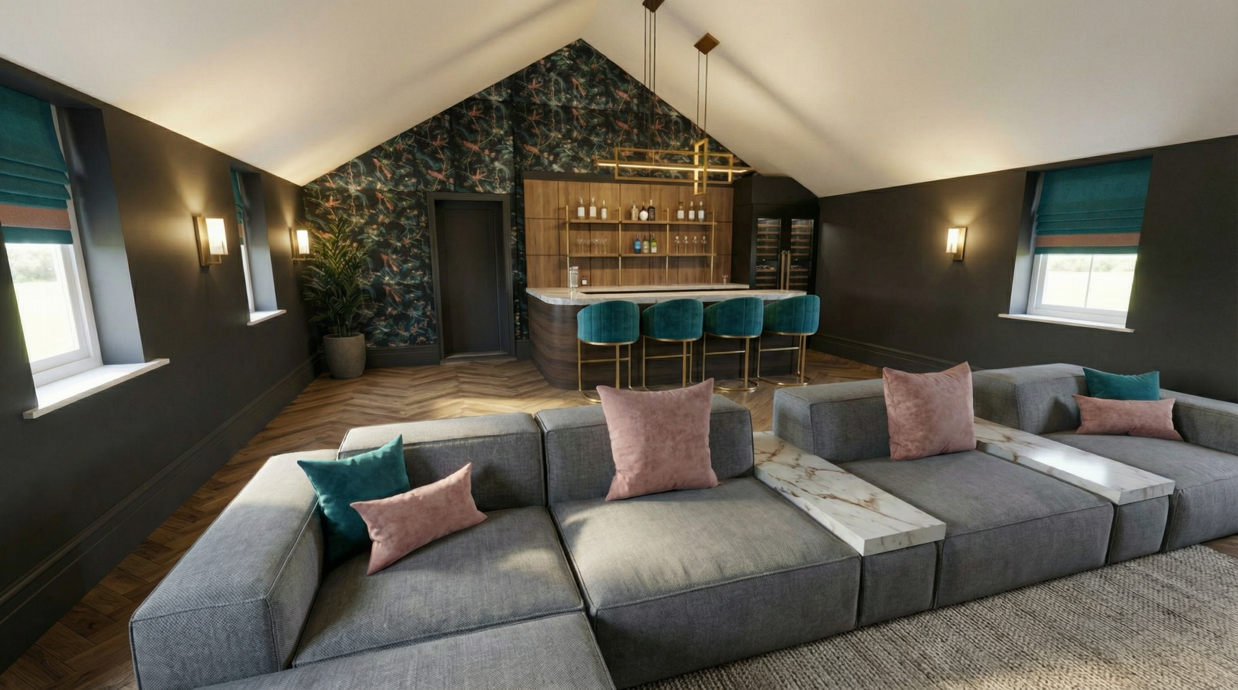 An elegant living room with dark walls, three windows with teal and brown blinds, a large gray sectional sofa with pink and teal pillows, and a marble-topped coffee table. In the background, a bar area with teal velvet chairs, wooden shelving with bo