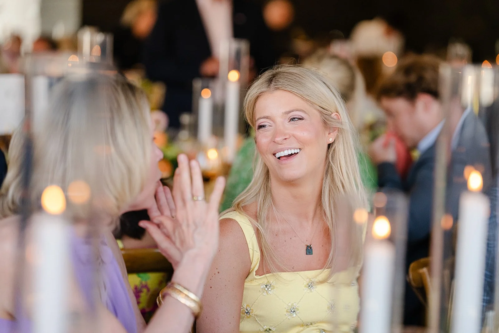 laughing wedding guests, blond women talking at Utah wedding celebration, Wedding venue in Park City Utah