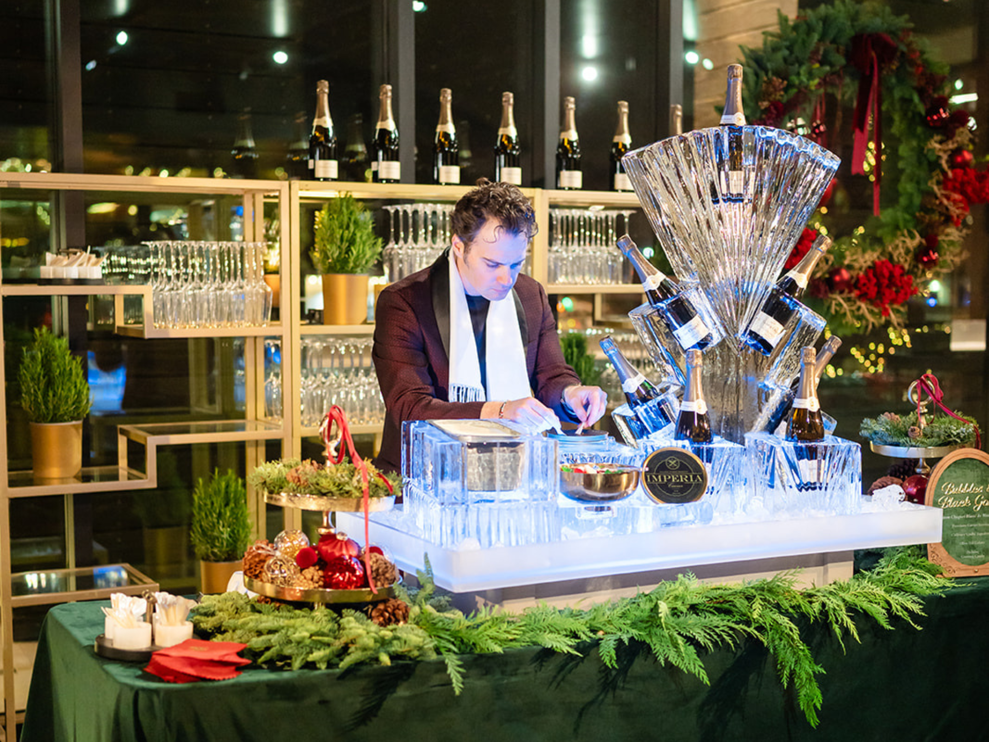Ryan Crafts, Culinary Crafts, Utah caterer, Park City venue, elevated Christmas celebration, pine boughs, caviar, ice sculpture, champagne on ice, caviar and gelato, champagne bottles, wine glasses, champagne glasses