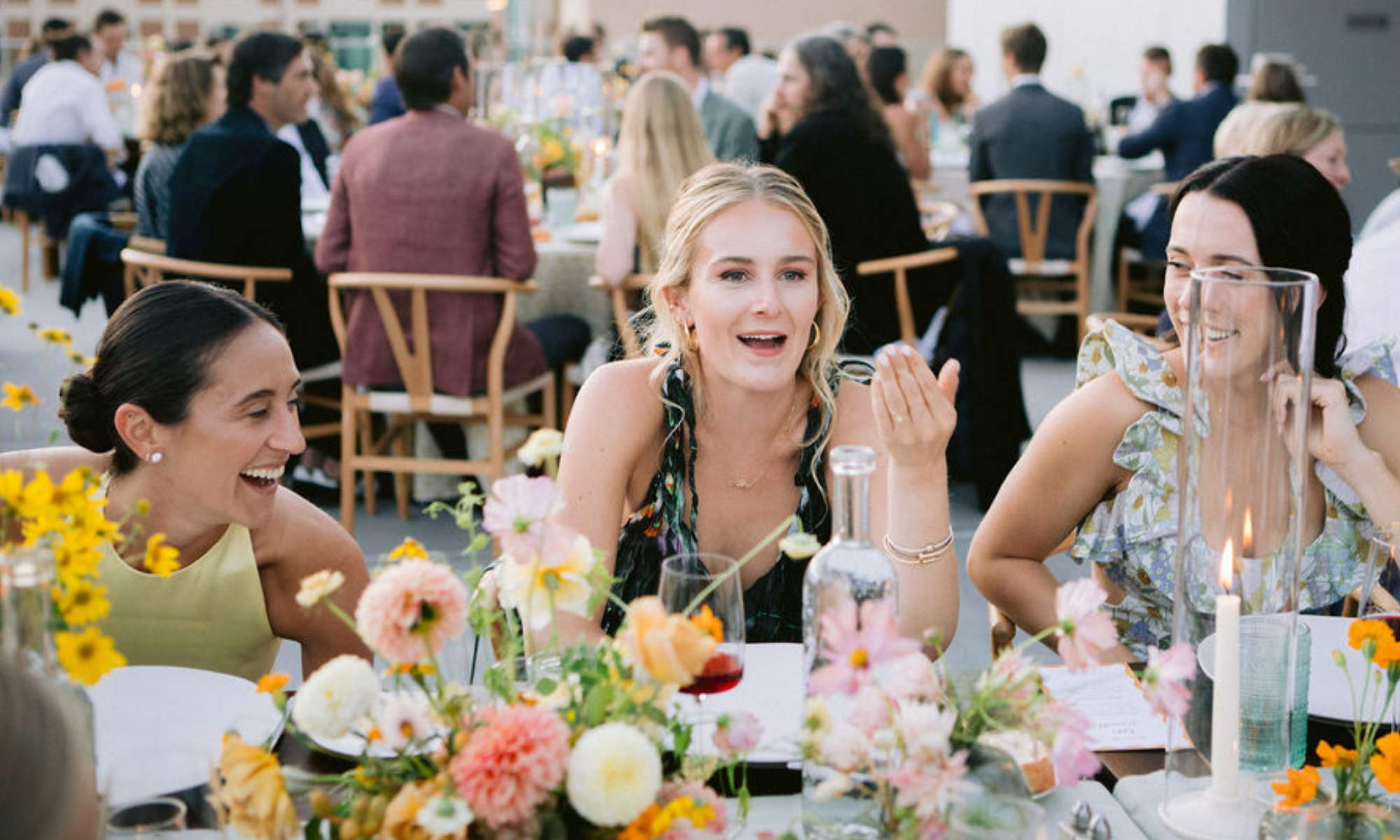 Women talking at fancy wedding dinner