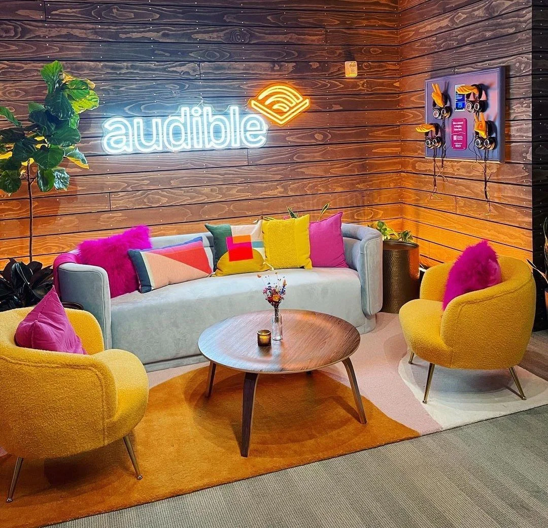 Sundance Film Festival 2023, Kimball Terrace, Audible, couch, chairs, bright colors, neon, pink and yellow, cushions, wood panel, nook, interview setting, carpet, celebrity interviews, Culinary Crafts