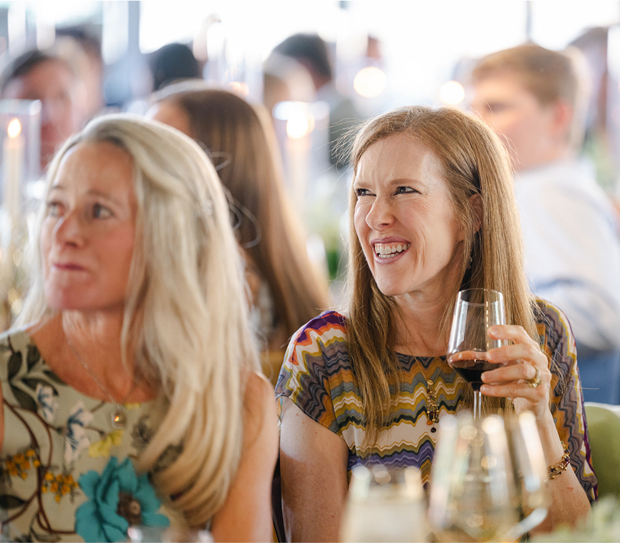 wedding guests smiling at Park City Utah wedding at Kimball Terrace