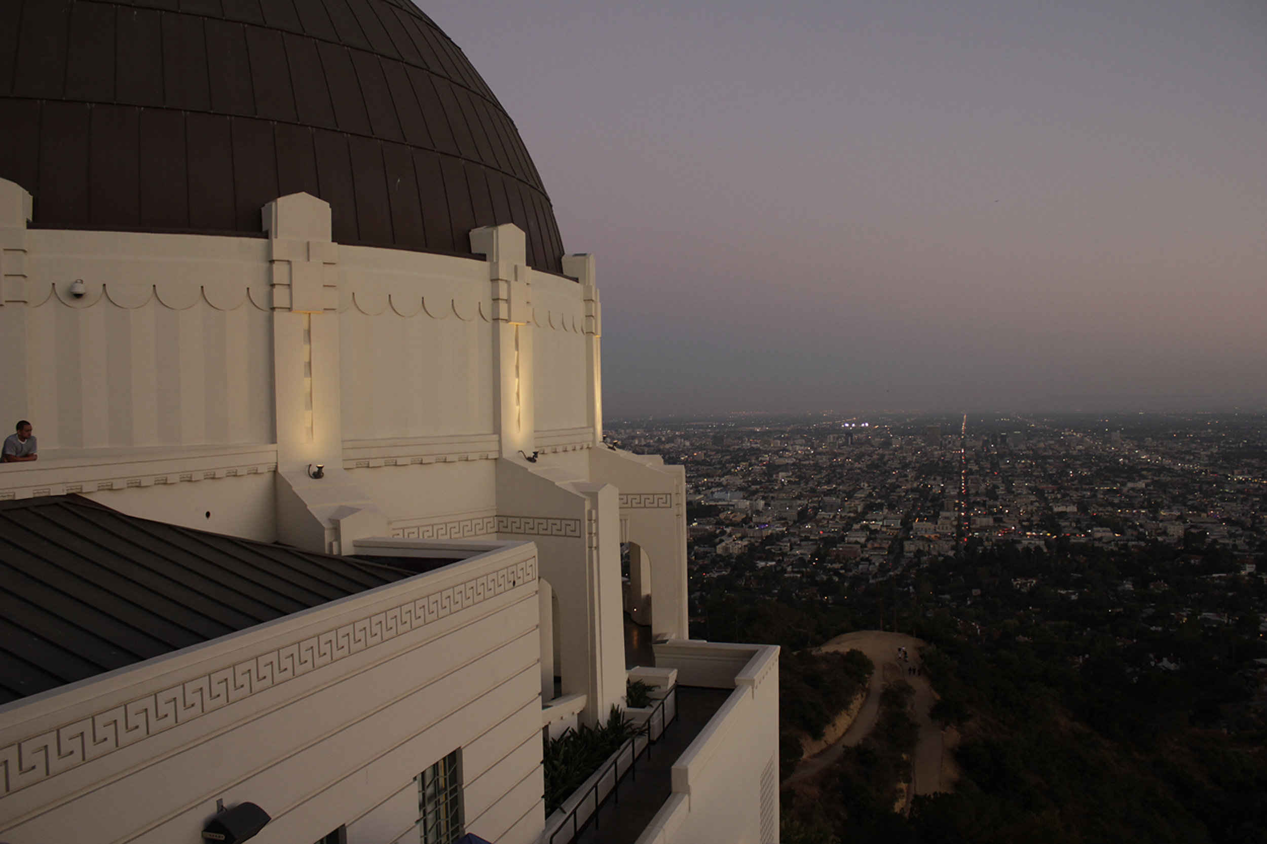 One of Los Angeles' most iconic buildings, the Griffith Observatory, and a view of the city at dusk.