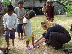Dr. Suzanne Levine helping a young girl to find the right size.