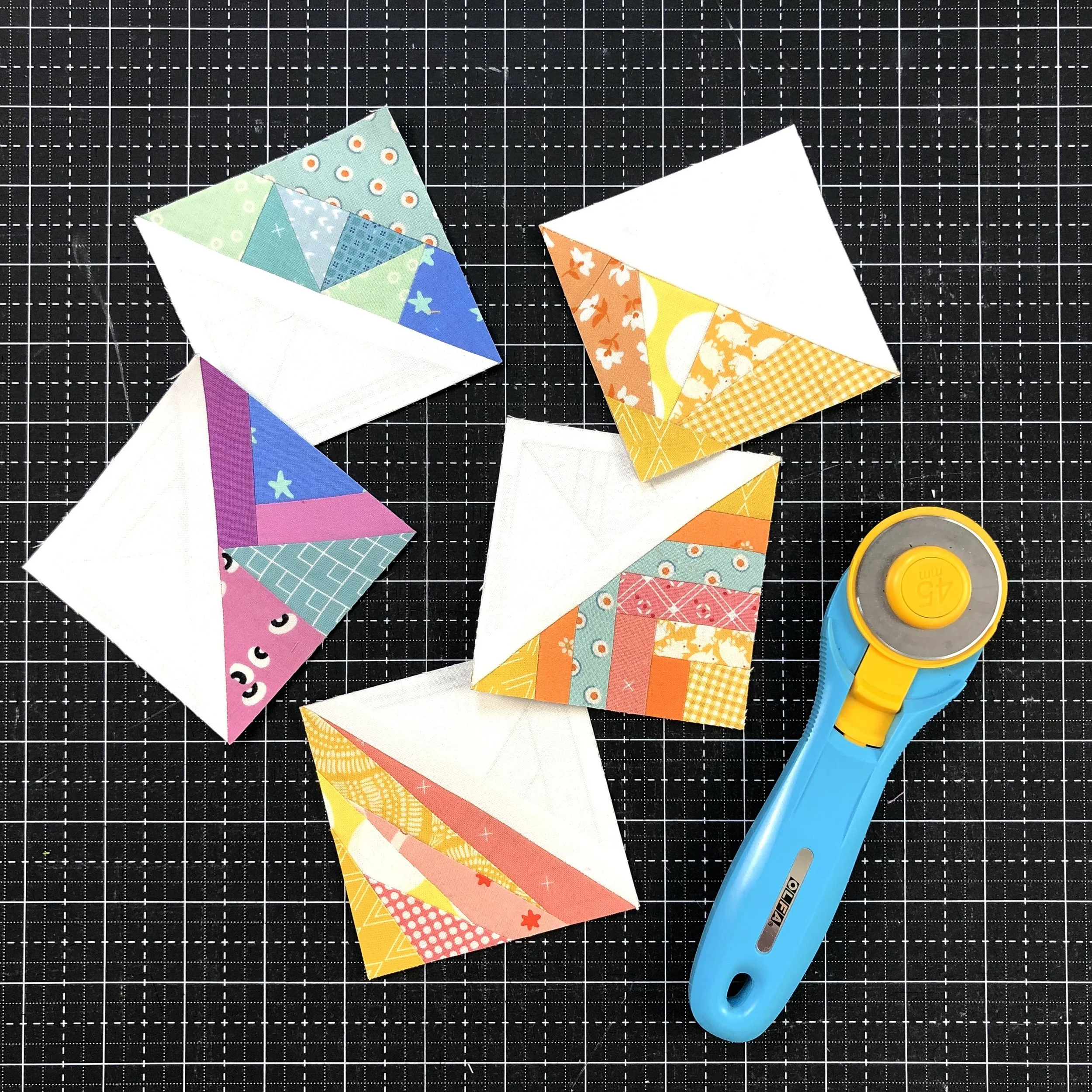 3" scrappy triangle quilt blocks.jpeg