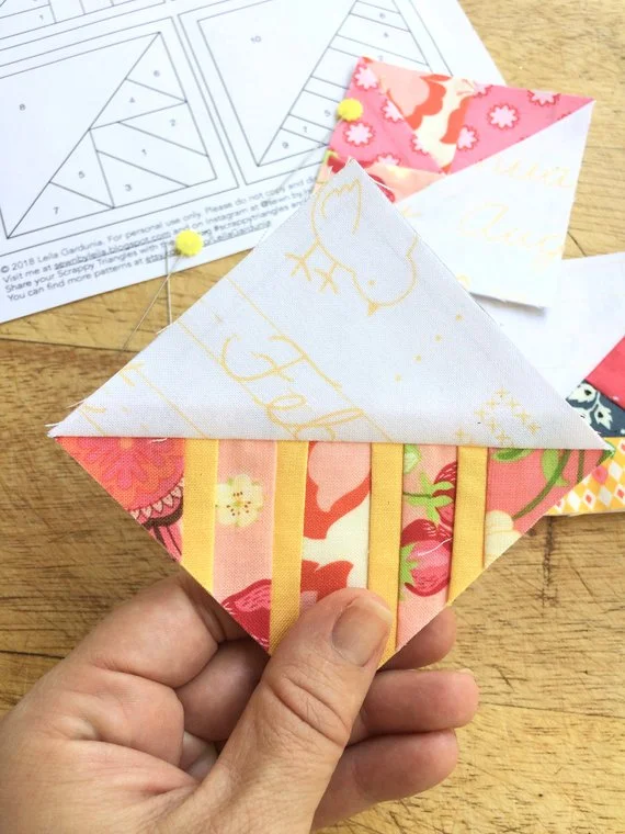 closeup of 3%22 scrappy triangle in pink and yellow.jpg