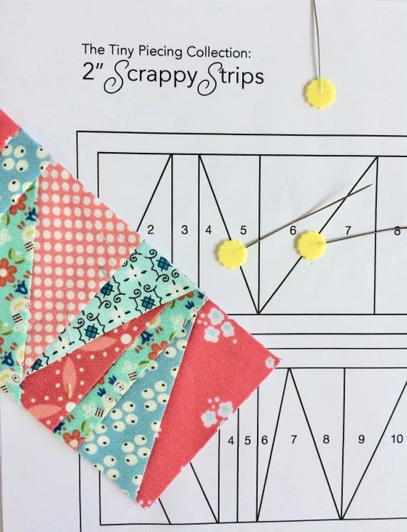 abstract pink and aqua 2%22 foundation paper pieced scrappy strip on top of foundation.jpg