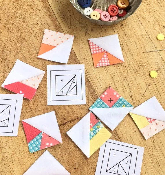 1%22 scrappy triangles scattered with foundations and pins.jpg