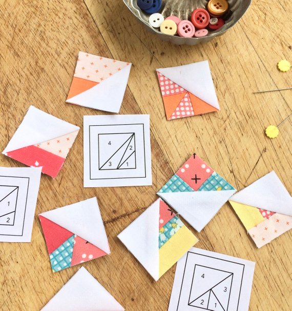 scrappy triangles scattered with foundations and pins.jpg