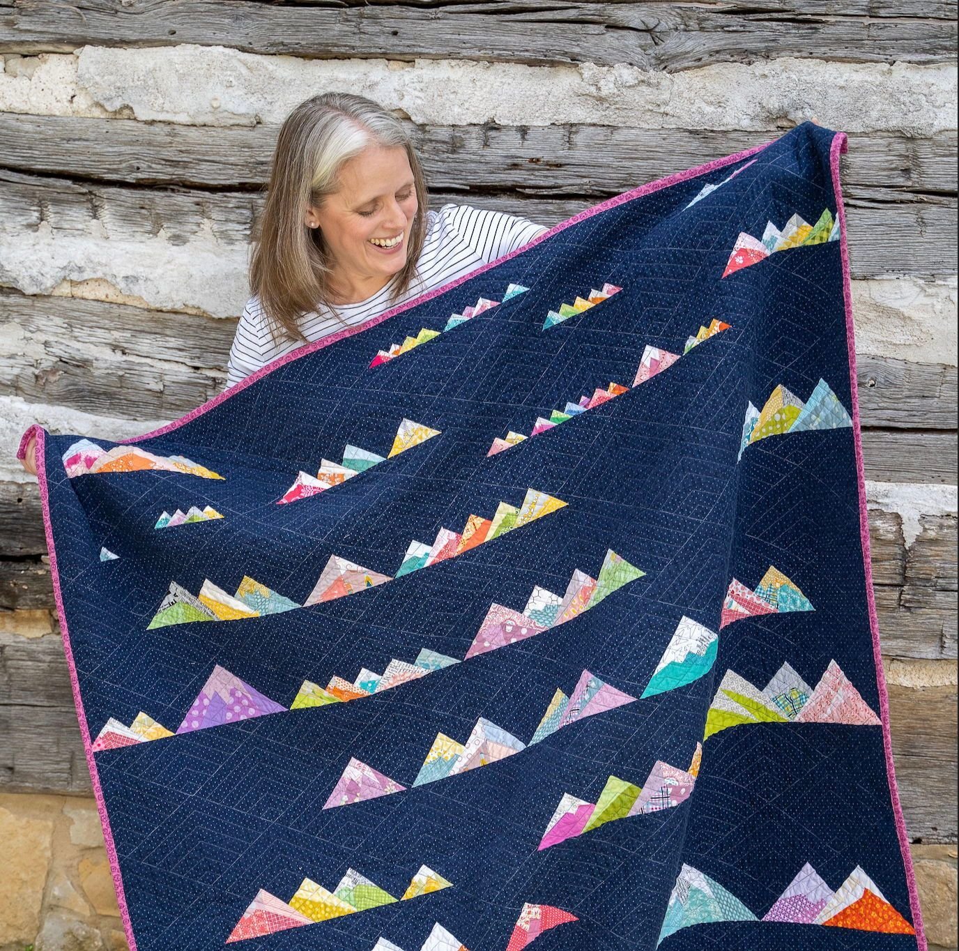 Need more mountains in your life? I've got you covered 👍 - with a quilt. 😜 (My kids don't think I'm funny, but I think I'm hilarious.)⁣
⁣
This Scrappy Mt Ranges pattern is in my shop and you can get a cute free mountain block pattern by joining the