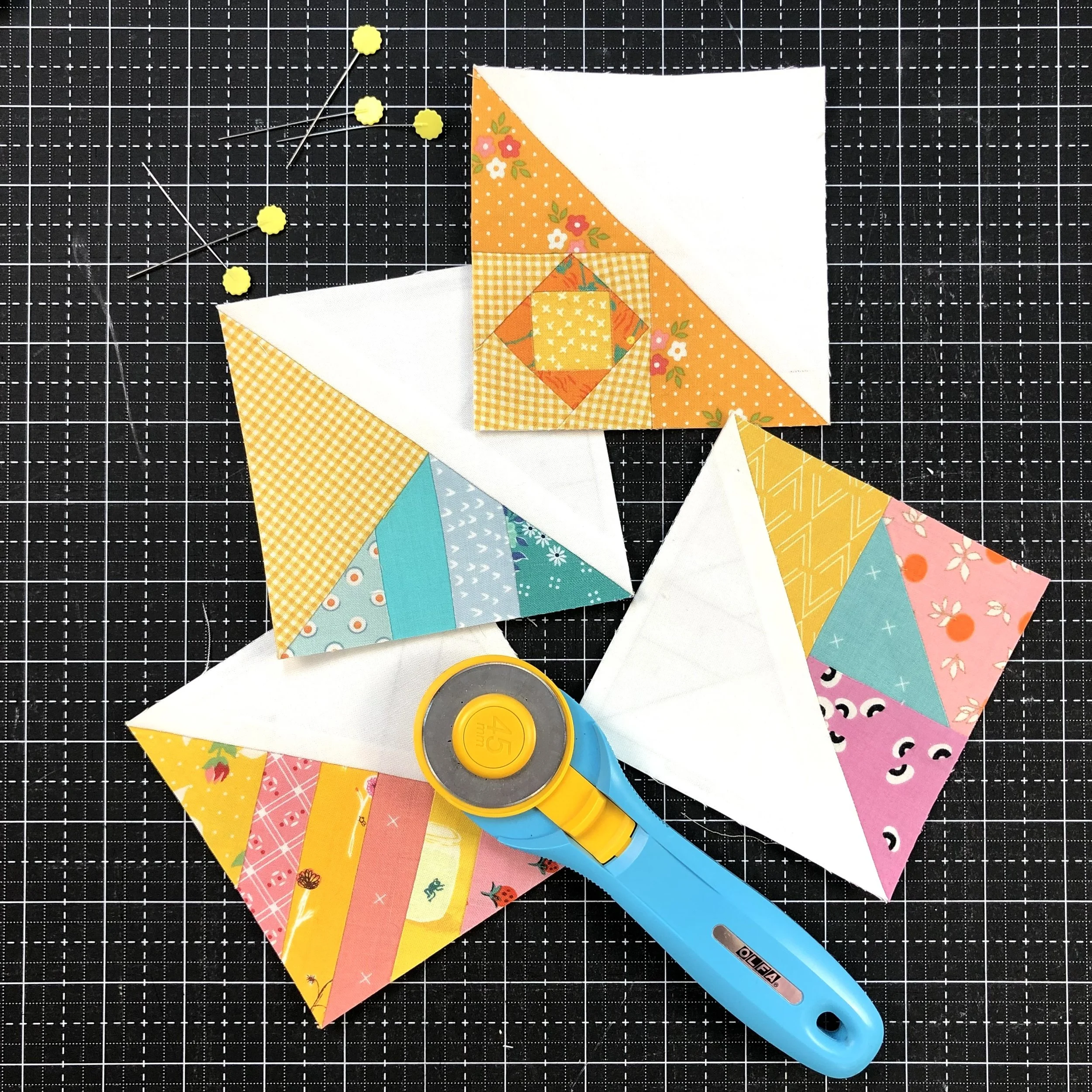 4 inch scrappy triangle quilt blocks.jpeg