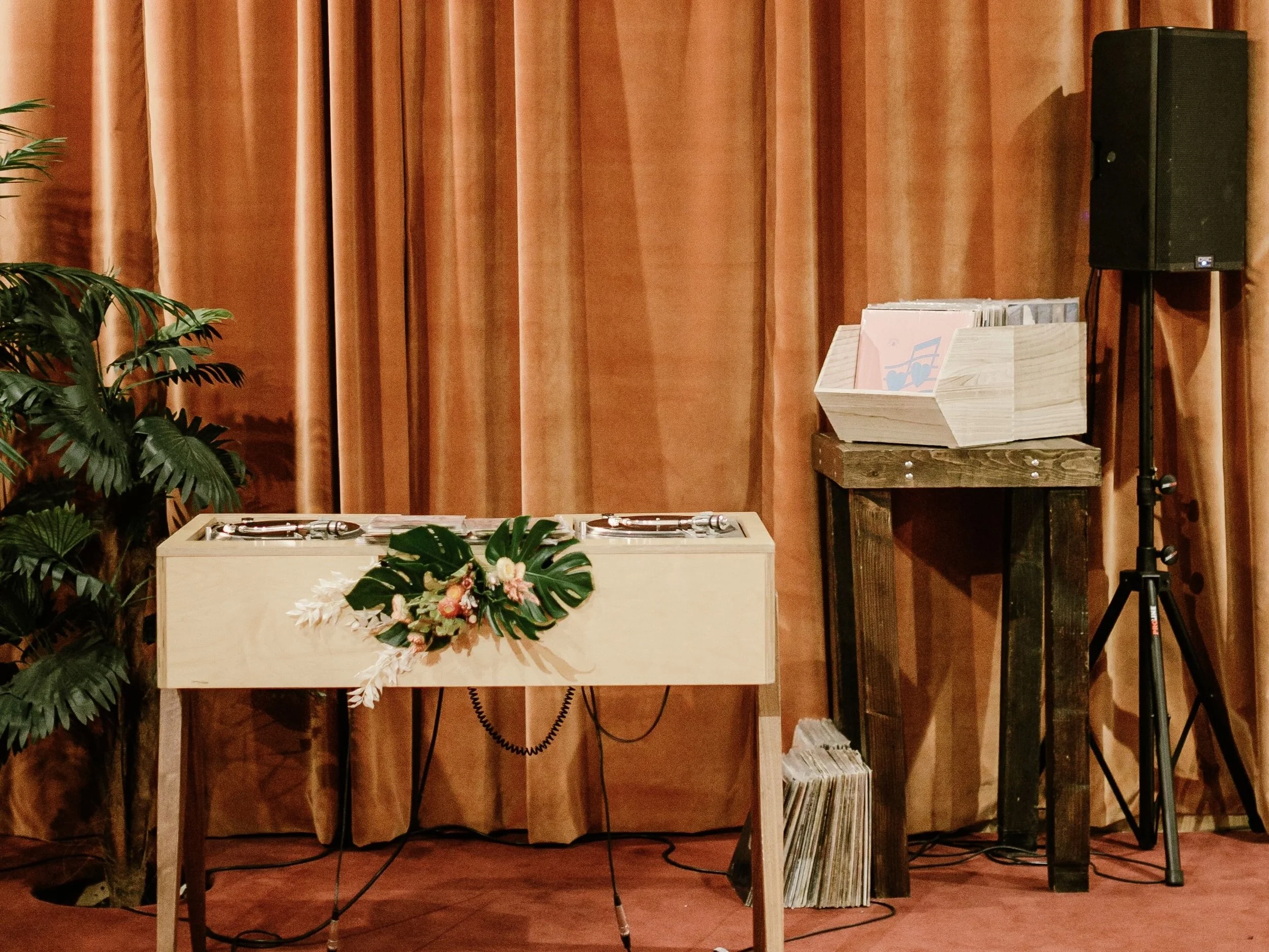 Supermoon vinyl DJ booth with turntables and curated records for wedding and events