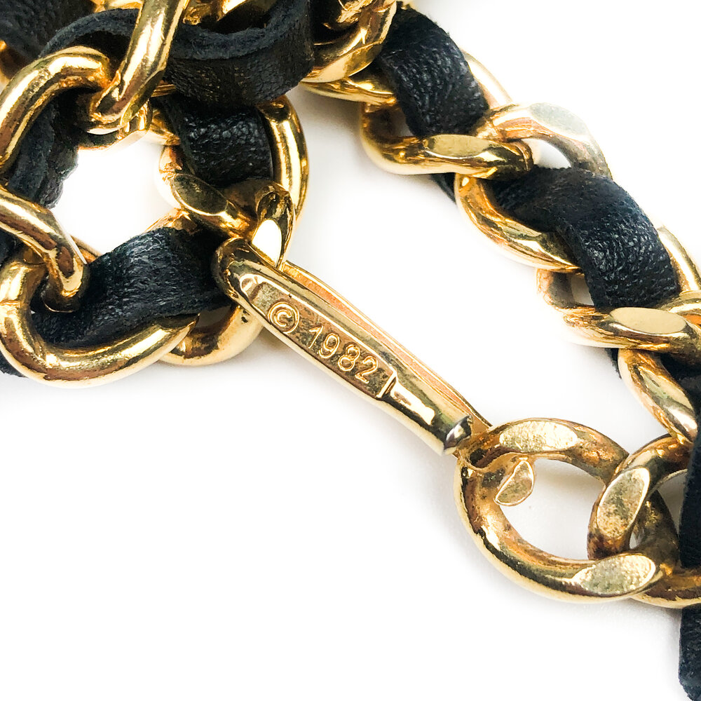 Iconic vintage Chanel gold chain and black leather belt