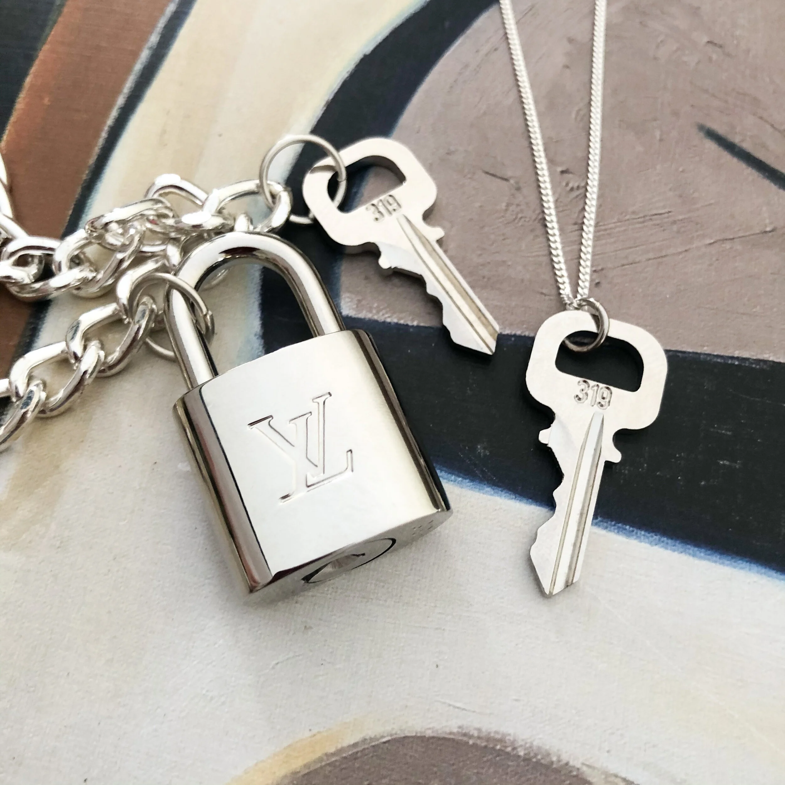 Silver Louis Vuitton Padlock Necklace 2025