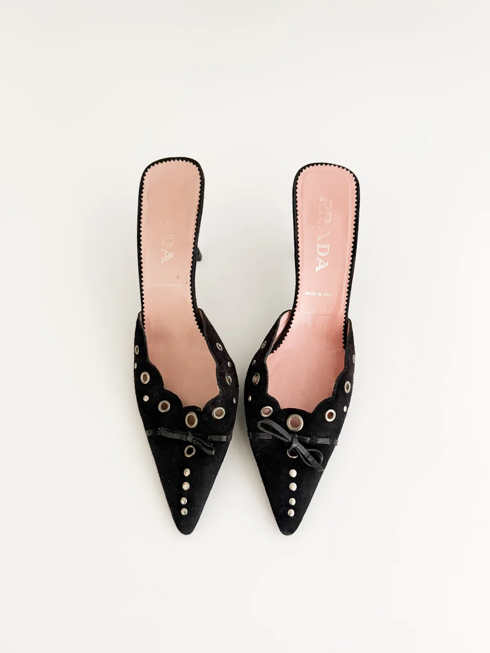 Prada Iconic Black Eyelet Bow Mule Heels (US 8 / IT 38) — sororité.