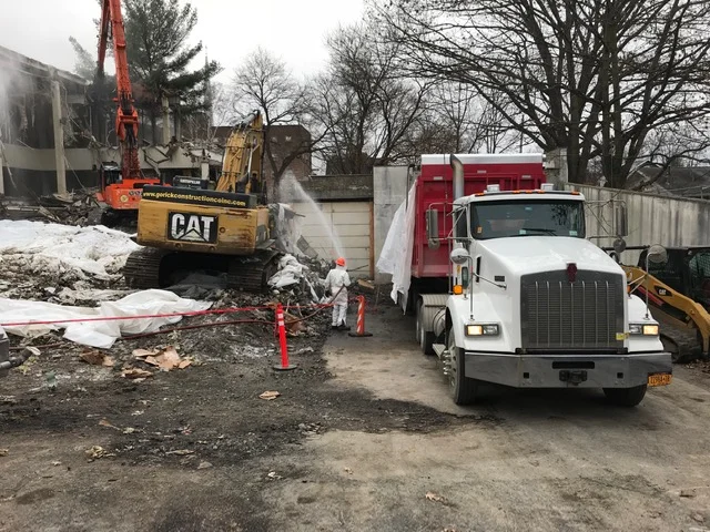 Wetting of debris while being loaded into the truck (front), wetting of building during demolition (back) - 1/7/2019 10:35am