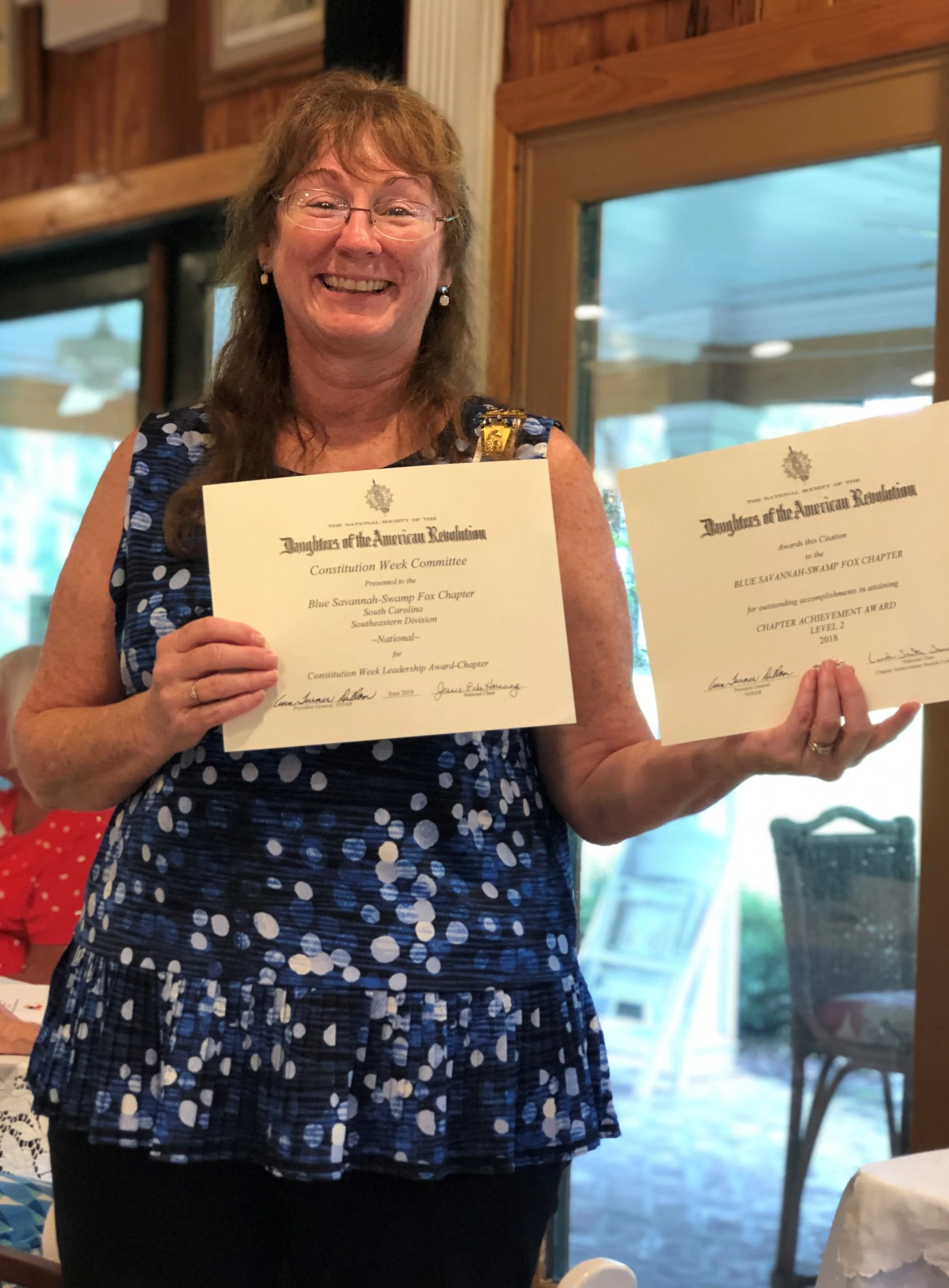 Dianne with Certificates .jpg