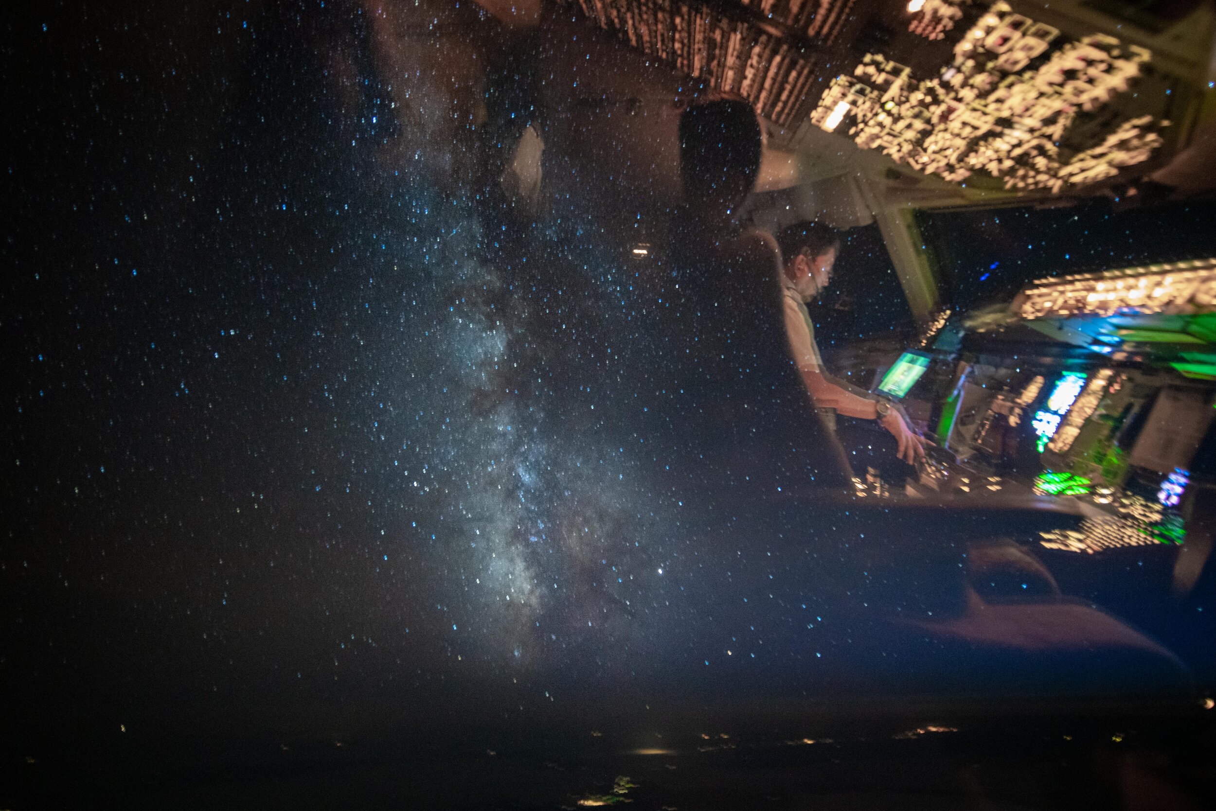  Flying west towards Portland, Oregon on a dark and quiet night. Here you can see the reflection of my first officer alongside the galactic center of the milky way. Even flying over the US with all of its brightly lit cities, on moonless nights it’s 