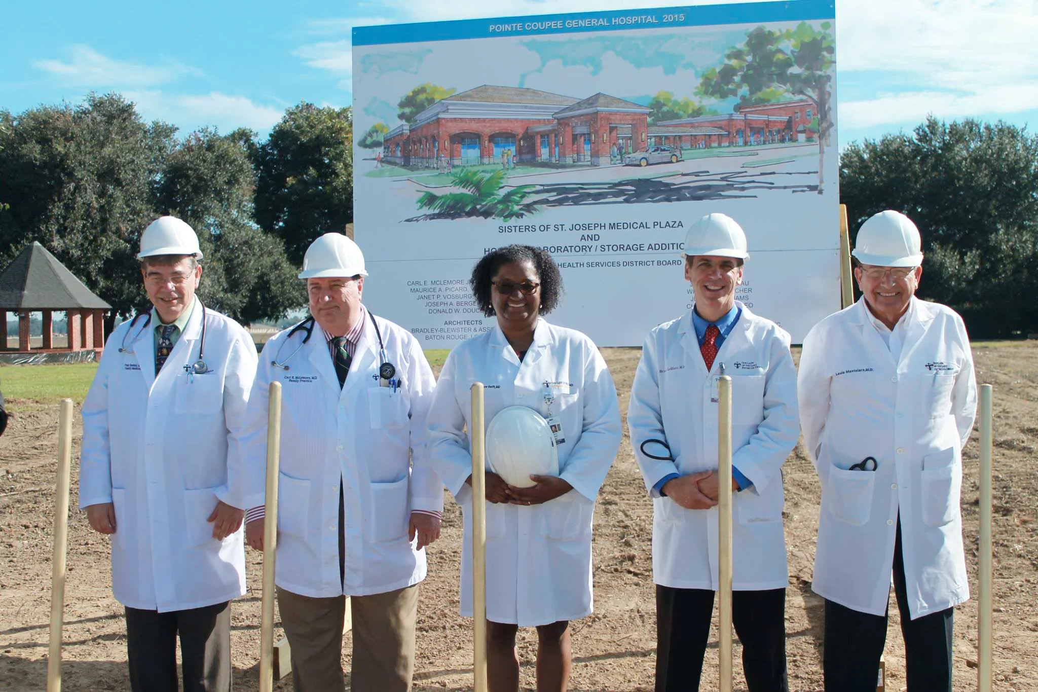 Our Lady of the Lake physicians (left to right) Dr. Paul Rachal, Dr. Carl McLemore, Dr. Carol Swift, Dr. Brian LeBlanc, and Dr. Louis Montelaro pose for photos in front of the future site of their new offices.
