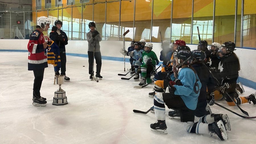  "Back when that jersey was a dress on me, I was the only girl on my team. Yesterday, I got to show the cup to the first ever girls’ Cyclones team. Way cool." 