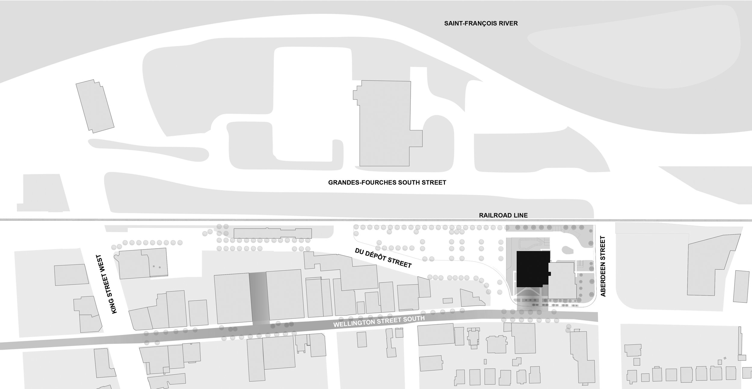 Plan de site en noir et blanc illustrant l'implantation du Grand Espace à l'intersection des rues Wellington Sud et Dépôt à Sherbrooke, incluant son intégration au Centre des arts de la scène Jean-Besré.