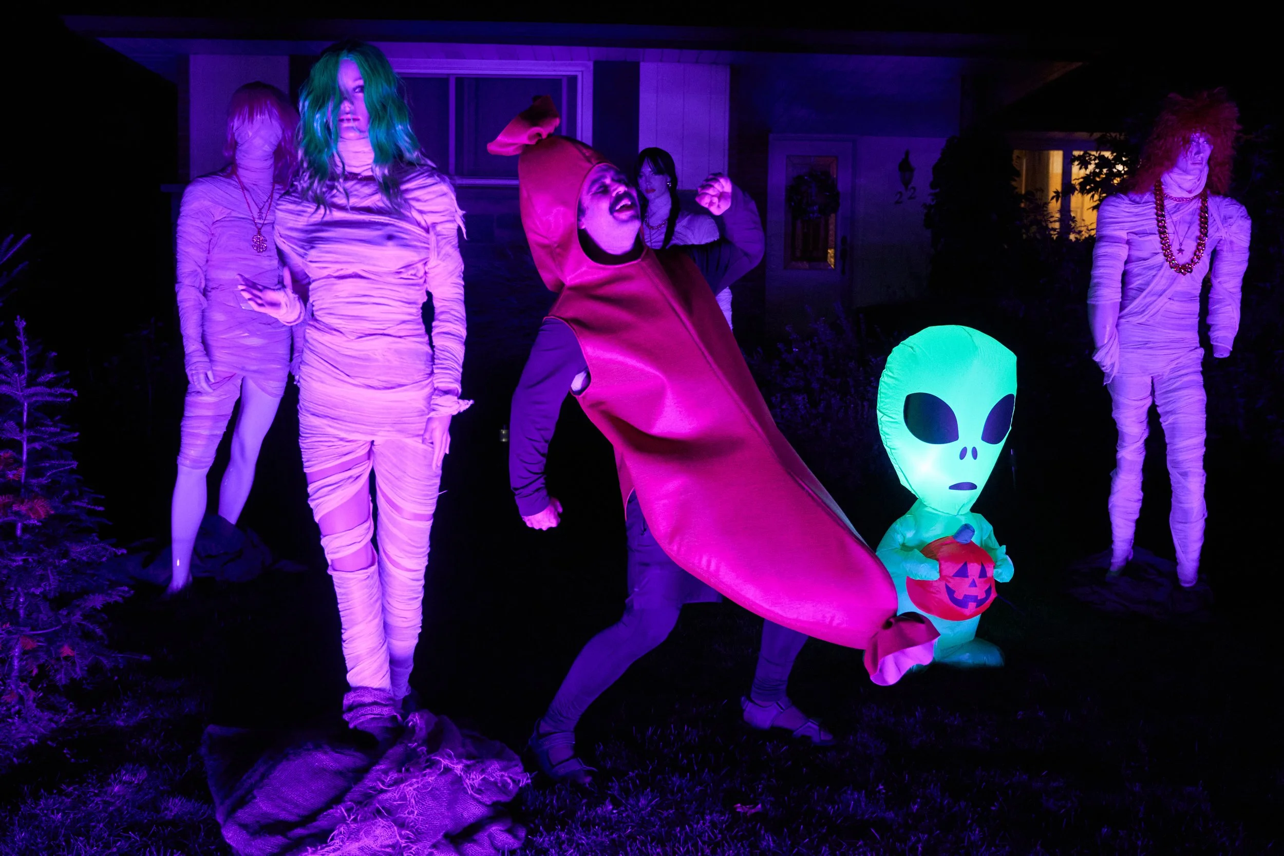 Sebastian (Chris Locke) in costume with others in a scene from RUN THE BURBS S3_RTB3_Blk2_D11_BTS_IW_0345_credit Ian Watson.jpeg