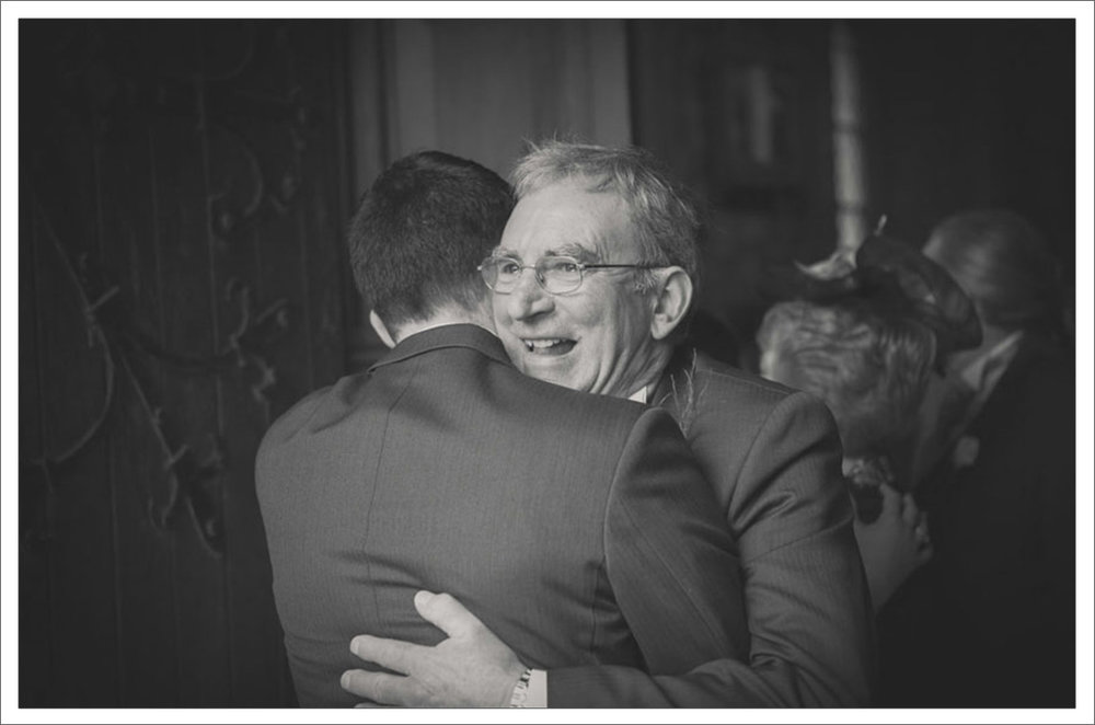 24-Father-and-son-embrace-on-wedding-day-Adare-Limerick-photography1.jpg